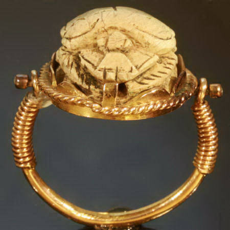 Typical Egyptian scarab ring with cartouched scarab set in gold swivel ring (image 9 of 15)